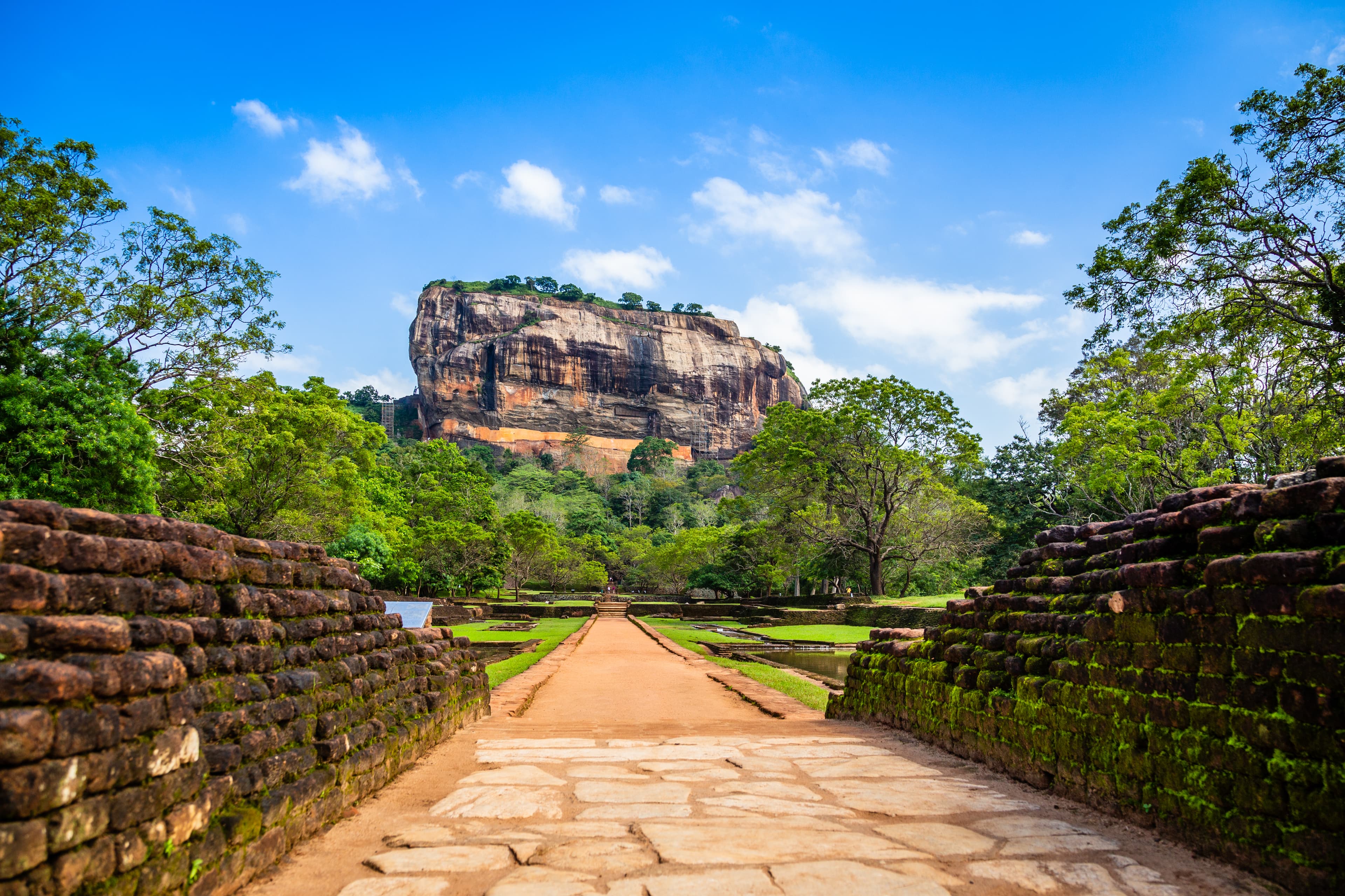 Sigiriya Lion Rock ancient fortress with brick wall foreground, Dambulla, Sri Lanka