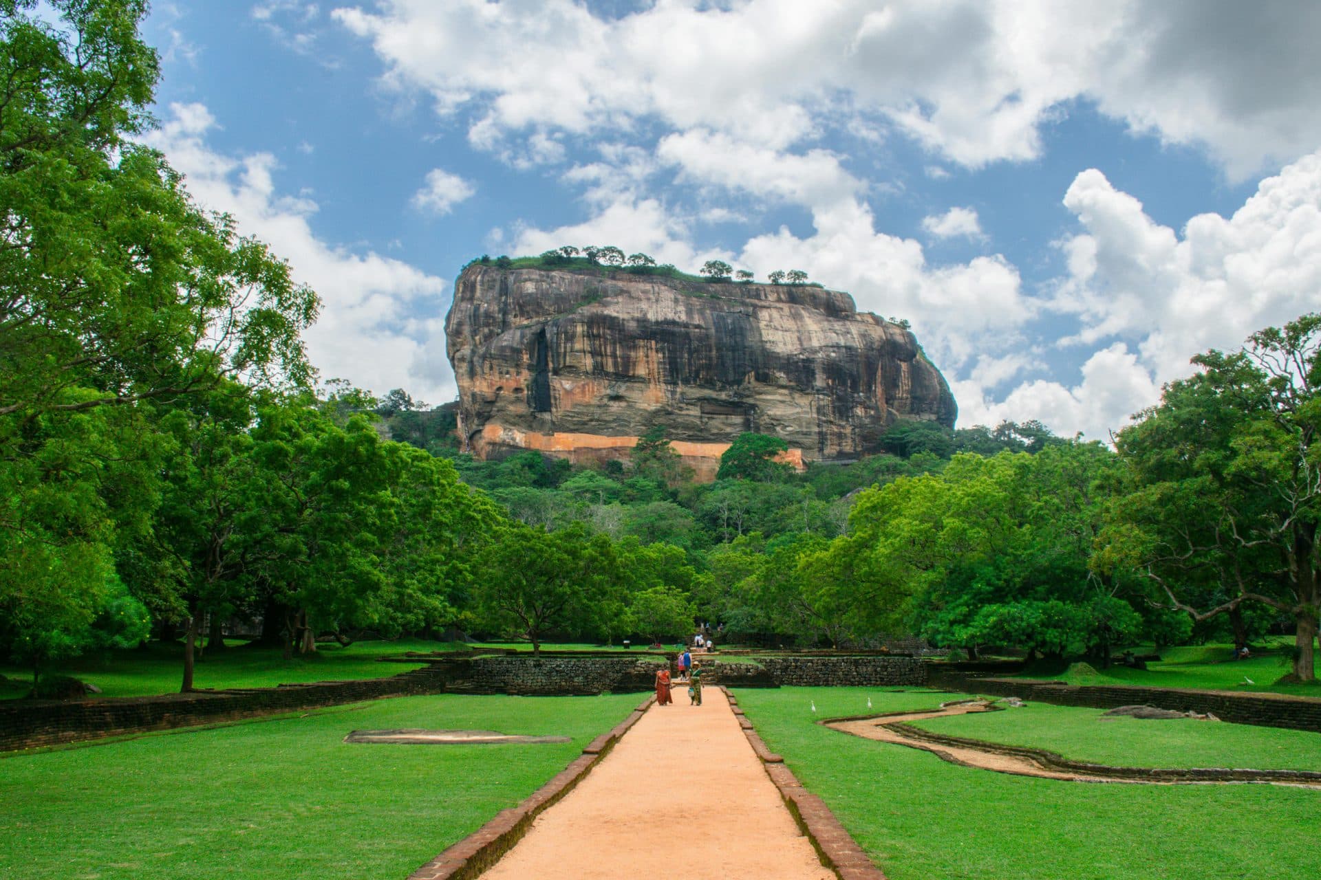Sigiriya Lion Rock fortress rising above lush green landscapes in Sri Lanka