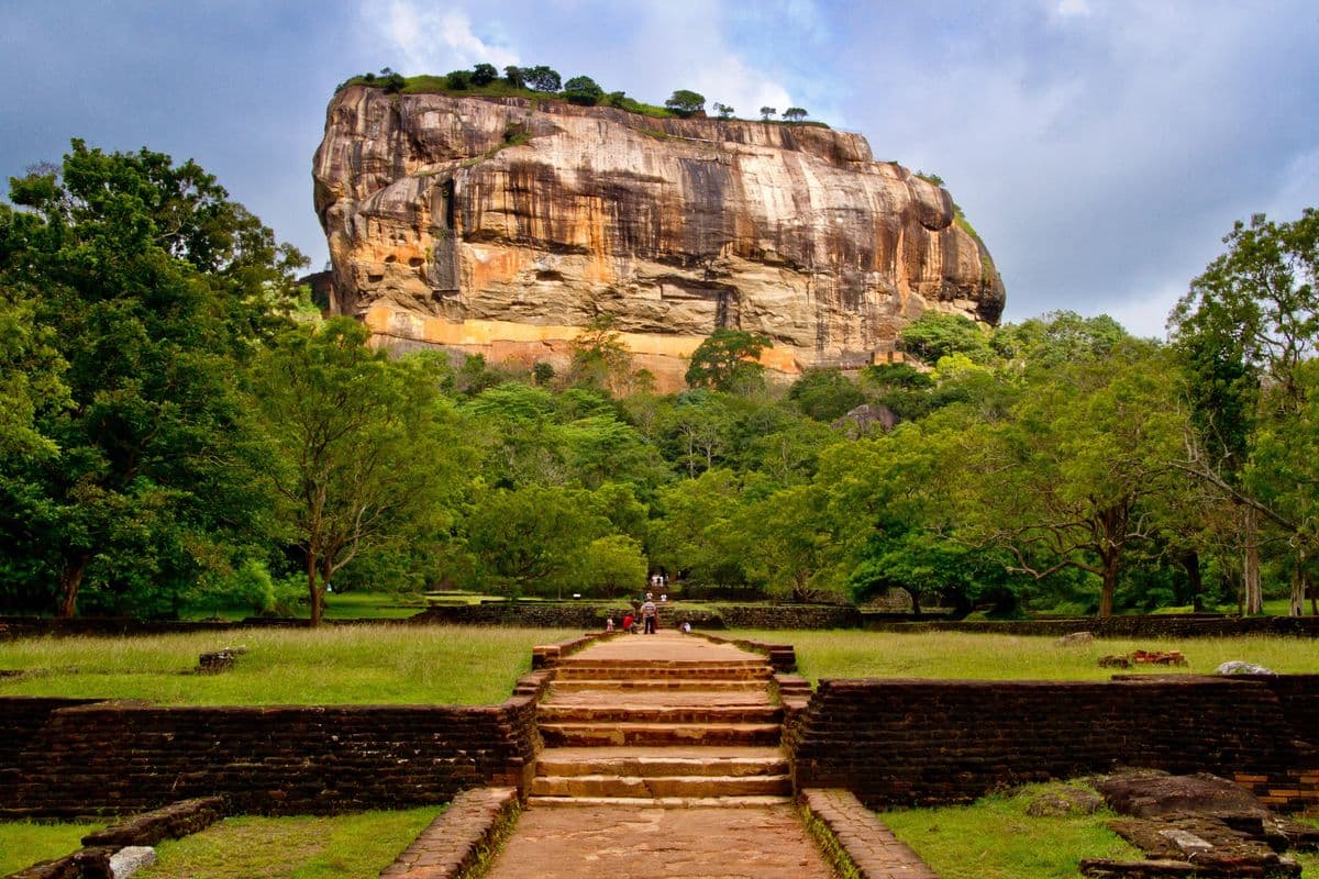 Sigiriya Rock Fortress surrounded by ancient royal gardens and lush greenery